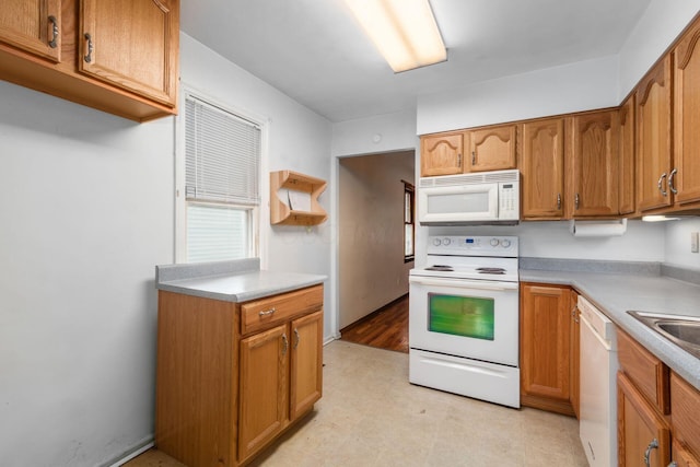 2969 Grasmere Ave, Columbus, OH 43224 - kitchen with white appliances, open shelves, brown cabinetry, and light flooring