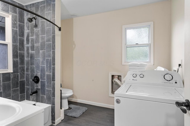 185 S Princeton Ave, Columbus, OH 43223 - bathroom with washer / clothes dryer, wood finished floors, and shower / tub combination