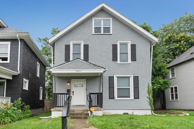 185 S Princeton Ave, Columbus, OH 43223 - view of front of home with stucco siding and a front lawn