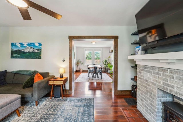 745 W Rich St, Columbus, OH 43222 - living room featuring wood finished floors, a ceiling fan, and a fireplace