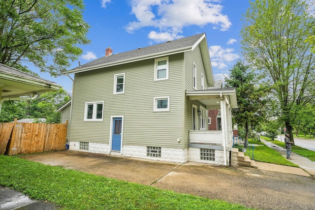 745 W Rich St, Columbus, OH 43222 - rear view of house with a chimney, a shingled roof, and covered porch