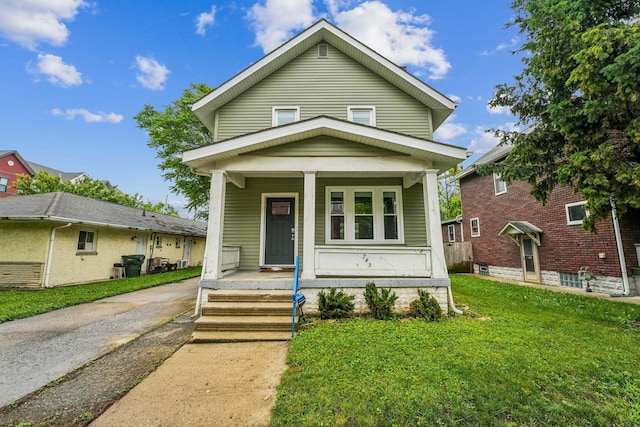 745 W Rich St, Columbus, OH 43222 - view of front of home with covered porch and a front lawn
