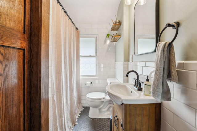 745 W Rich St, Columbus, OH 43222 - bathroom featuring tile walls, vanity, tile patterned flooring, and a shower with curtain