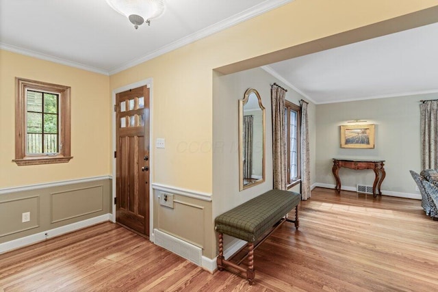 116 W Royal Forest Blvd, Columbus, OH 43214 - entrance foyer featuring light wood-style flooring, crown molding, and wainscoting