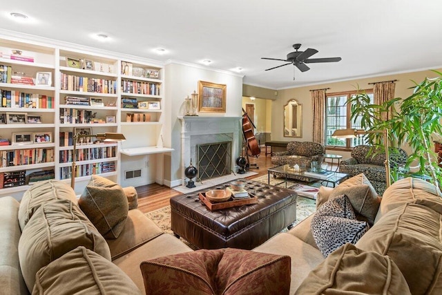 116 W Royal Forest Blvd, Columbus, OH 43214 - living room with crown molding, ceiling fan, wood finished floors, and a high end fireplace