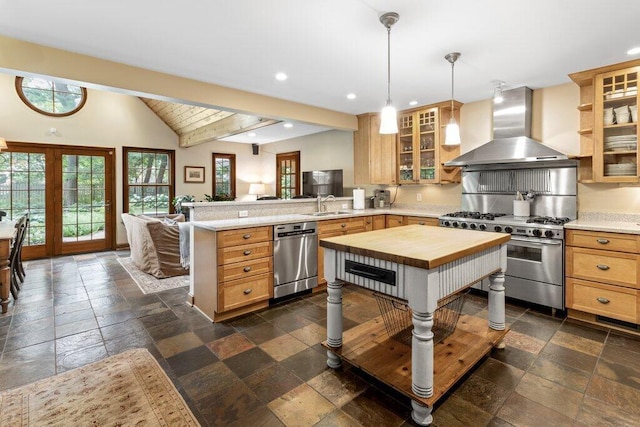 116 W Royal Forest Blvd, Columbus, OH 43214 - kitchen featuring wall chimney range hood, stainless steel appliances, stone tile floors, a peninsula, and recessed lighting