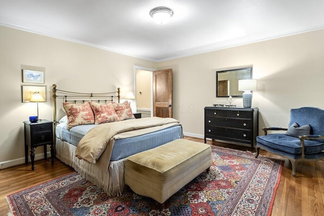 116 W Royal Forest Blvd, Columbus, OH 43214 - bedroom featuring crown molding and wood finished floors
