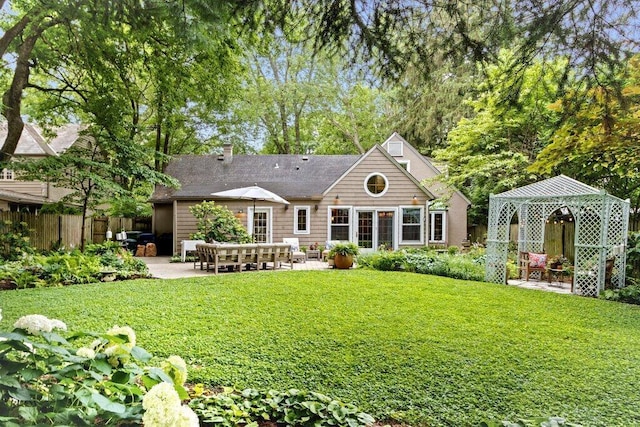 116 W Royal Forest Blvd, Columbus, OH 43214 - rear view of property with a patio area, a gazebo, and a chimney