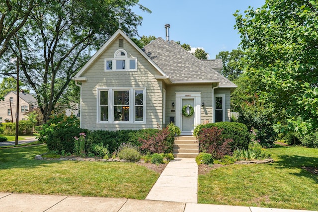 1734 W 1st Ave, Grandview, OH 43212 - view of front of property with a front yard and roof with shingles