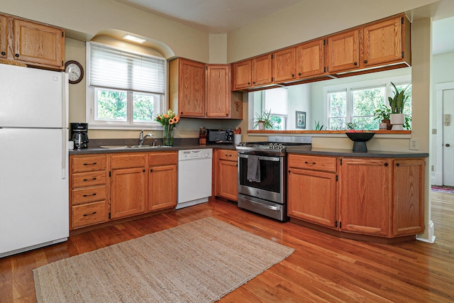 1734 W 1st Ave, Grandview, OH 43212 - kitchen with white appliances, plenty of natural light, and dark countertops