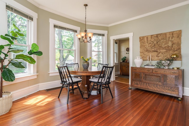 1734 W 1st Ave, Grandview, OH 43212 - dining room with a chandelier, plenty of natural light, hardwood / wood-style floors, and crown molding