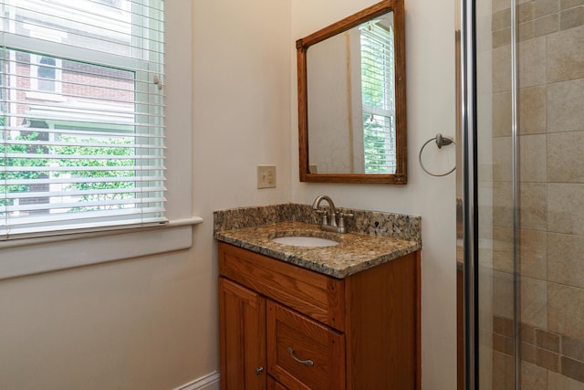 1734 W 1st Ave, Grandview, OH 43212 - bathroom featuring vanity, plenty of natural light, and a tile shower