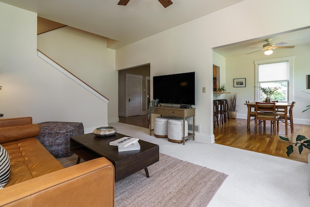 1734 W 1st Ave, Grandview, OH 43212 - living room with ceiling fan, stairway, and carpet floors