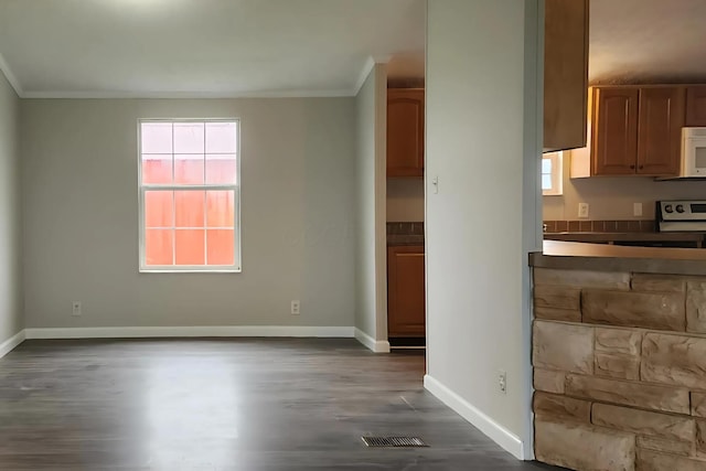 6447 Scioto Farms Rd Unit Se, Washington Court House, OH 43160 - unfurnished dining area featuring crown molding and dark wood-style flooring