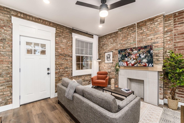 887-891 S 22nd St, Columbus, OH 43206 - living room with ceiling fan, brick wall, wood finished floors, and a tiled fireplace