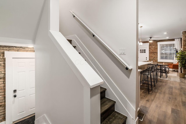 887-891 S 22nd St, Columbus, OH 43206 - stairs featuring wood finished floors, brick wall, and a ceiling fan