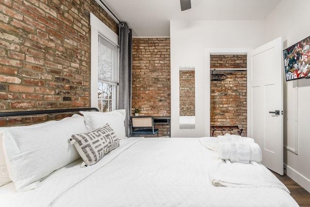 887-891 S 22nd St, Columbus, OH 43206 - bedroom with brick wall, wood finished floors, and ceiling fan