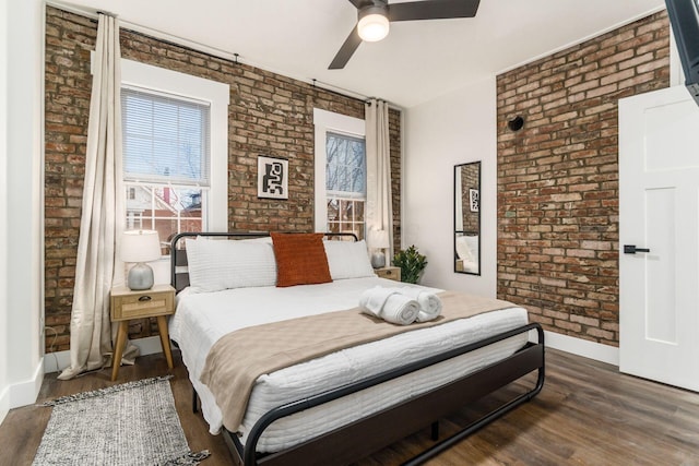 887-891 S 22nd St, Columbus, OH 43206 - bedroom with brick wall, wood finished floors, and ceiling fan