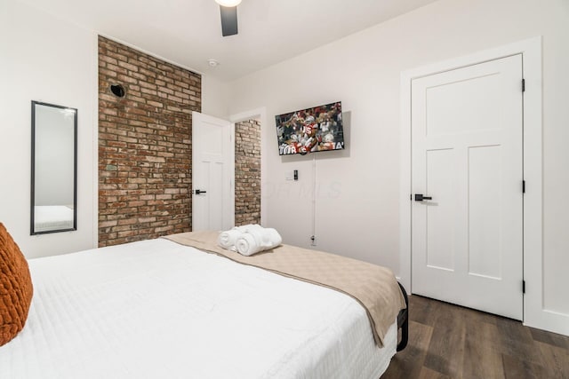 887-891 S 22nd St, Columbus, OH 43206 - bedroom featuring dark wood-type flooring, brick wall, and ceiling fan
