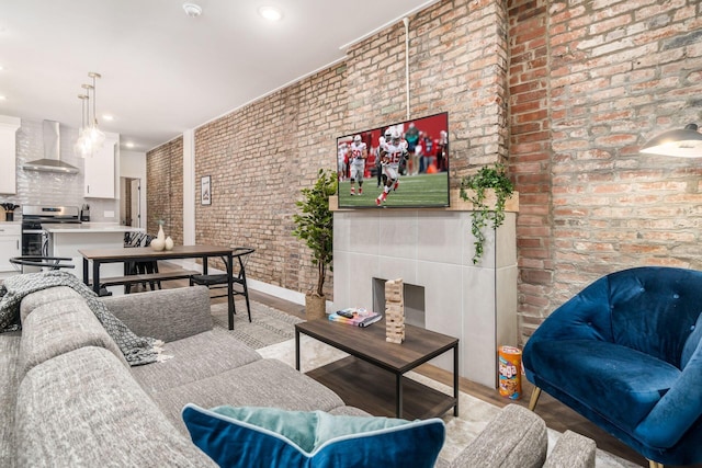 887-891 S 22nd St, Columbus, OH 43206 - living room with brick wall, wood finished floors, and recessed lighting