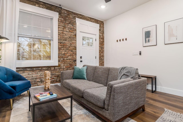 887-891 S 22nd St, Columbus, OH 43206 - living area featuring wood finished floors, brick wall, and a ceiling fan