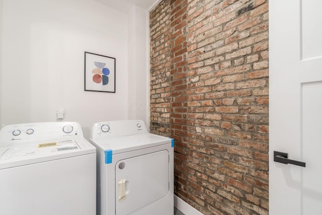 887-891 S 22nd St, Columbus, OH 43206 - laundry room featuring independent washer and dryer and brick wall