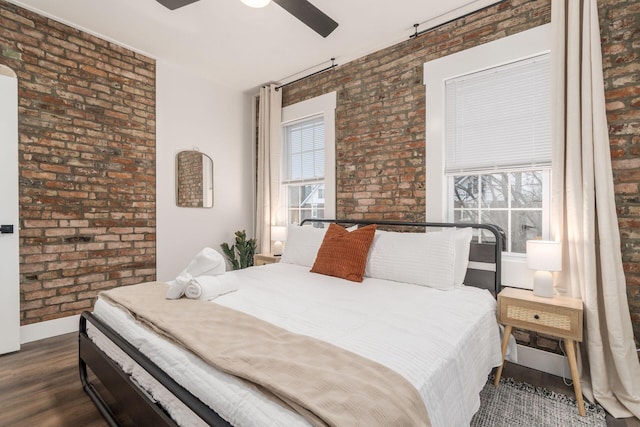 887-891 S 22nd St, Columbus, OH 43206 - bedroom featuring brick wall, wood finished floors, multiple windows, and a ceiling fan