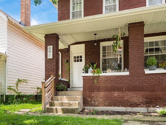 887-891 S 22nd St, Columbus, OH 43206 - doorway to property featuring brick siding and a porch