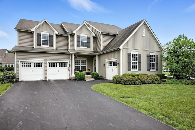 6946 Dean Farm Rd, New Albany, OH 43054 - view of front of home featuring asphalt driveway, a front lawn, board and batten siding, and a garage