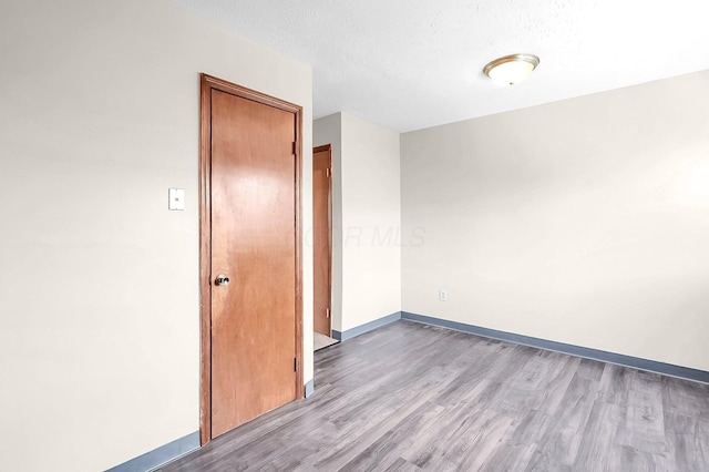 7385-7395 Cimmaron Sta, Columbus, OH 43235 - spare room featuring wood finished floors and a textured ceiling