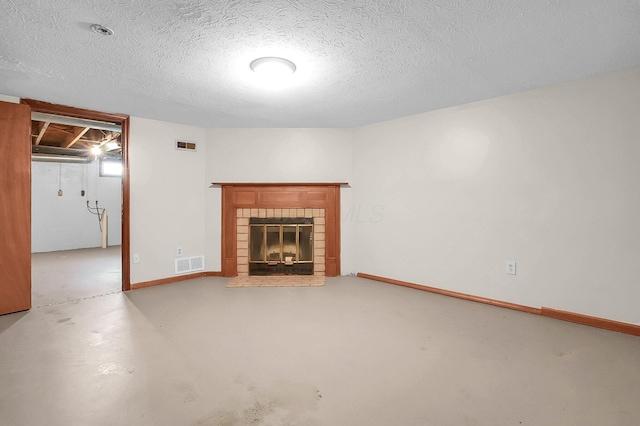 7385-7395 Cimmaron Sta, Columbus, OH 43235 - unfurnished living room featuring concrete flooring, a fireplace, and a textured ceiling