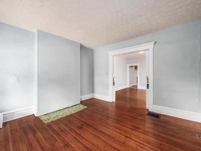 116-118 E Hudson St, Columbus, OH 43202 - spare room with wood finished floors and a textured ceiling