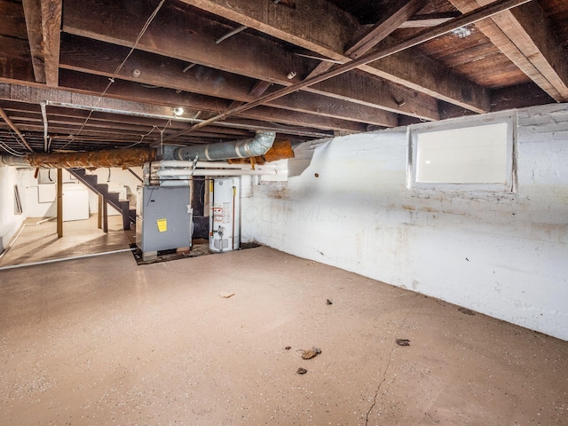 116-118 E Hudson St, Columbus, OH 43202 - unfinished basement featuring gas water heater, stairway, and heating unit