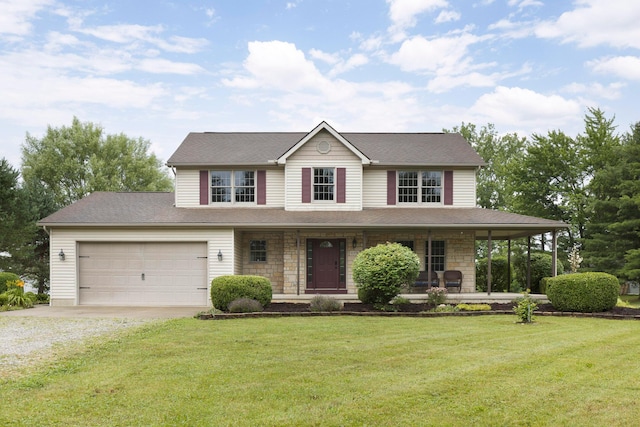 11578 Duncan Plains Rd NW, Johnstown, OH 43031 - view of front of house with driveway, a porch, a front lawn, and a garage