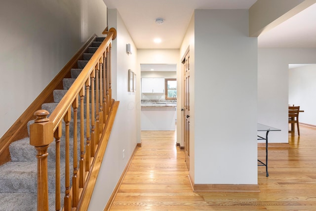 11578 Duncan Plains Rd NW, Johnstown, OH 43031 - hallway featuring light wood finished floors and stairway