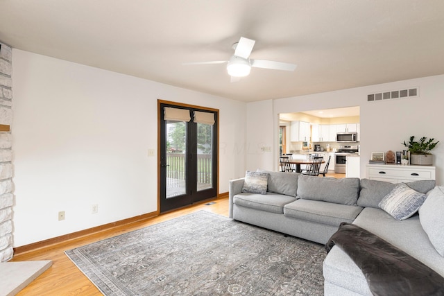 11578 Duncan Plains Rd NW, Johnstown, OH 43031 - living room with light wood-style floors and a ceiling fan