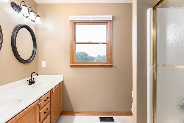 11578 Duncan Plains Rd NW, Johnstown, OH 43031 - bathroom with double vanity and a shower with door