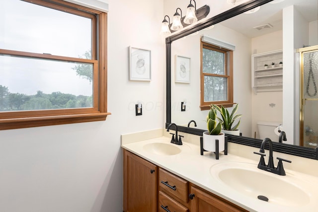 11578 Duncan Plains Rd NW, Johnstown, OH 43031 - full bath with double vanity, a shower with door, and plenty of natural light