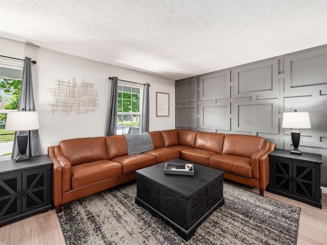 3552 Smiley Rd, Hilliard, OH 43026 - living area with light wood-type flooring and a textured ceiling