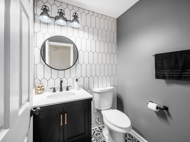3552 Smiley Rd, Hilliard, OH 43026 - half bath with vanity, tile walls, tasteful backsplash, and tile patterned flooring