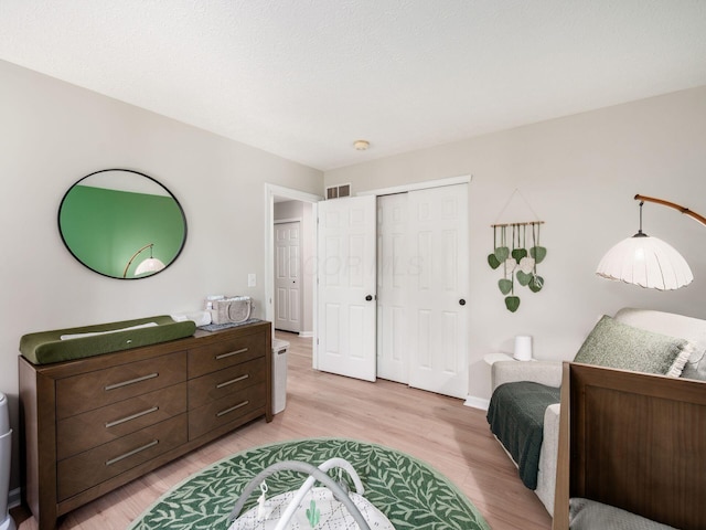 3552 Smiley Rd, Hilliard, OH 43026 - bedroom with light wood-style flooring and a closet