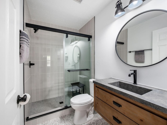 3552 Smiley Rd, Hilliard, OH 43026 - bathroom with vanity, a stall shower, tile patterned flooring, and a textured ceiling
