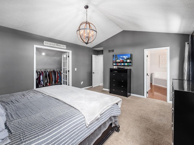 3552 Smiley Rd, Hilliard, OH 43026 - bedroom featuring lofted ceiling, a chandelier, a spacious closet, carpet floors, and a closet