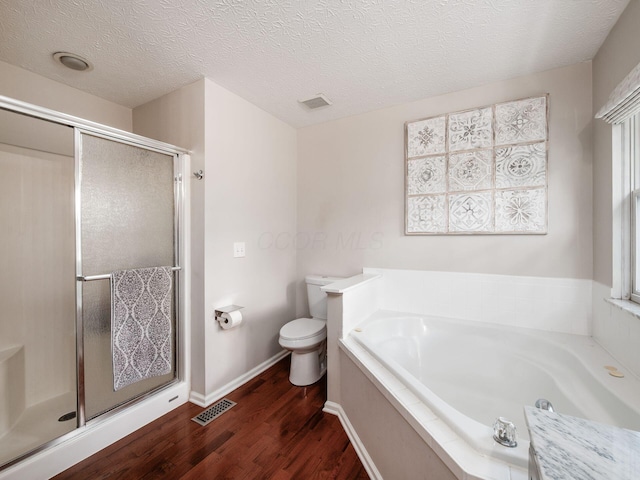 3552 Smiley Rd, Hilliard, OH 43026 - full bath with wood finished floors, a bath, a shower stall, and a textured ceiling