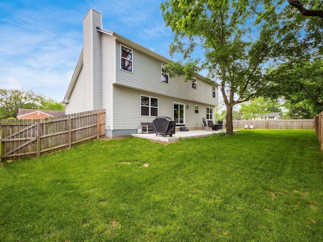 3552 Smiley Rd, Hilliard, OH 43026 - rear view of house featuring a chimney, a patio area, and a fenced backyard