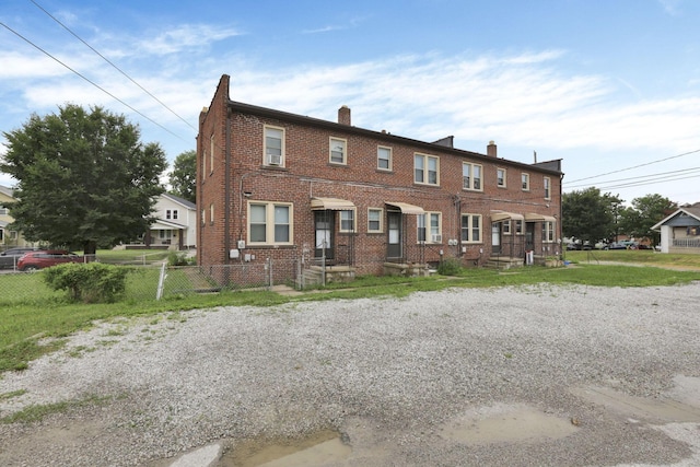 635-641 Racine Ave, Columbus, OH 43204 - view of property with a chimney and brick siding