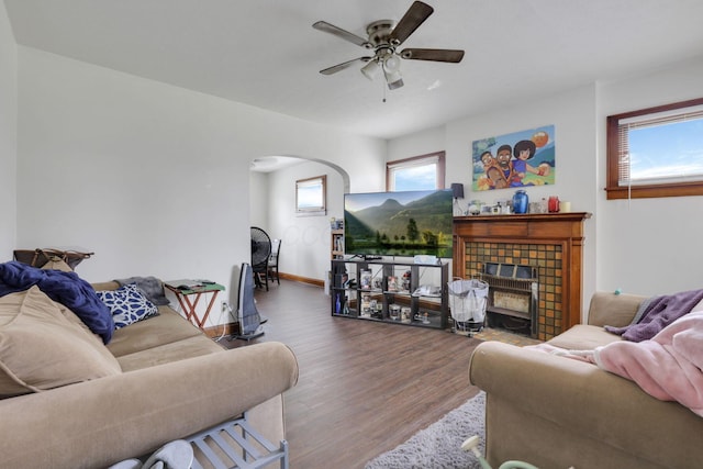 635-641 Racine Ave, Columbus, OH 43204 - living room with arched walkways, ceiling fan, wood finished floors, and a fireplace