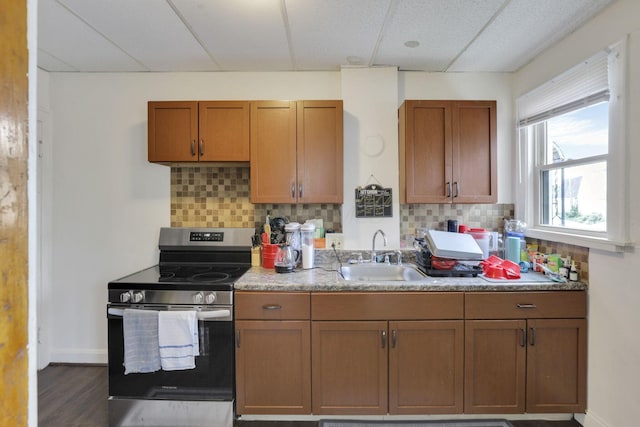 635-641 Racine Ave, Columbus, OH 43204 - kitchen featuring electric range, a drop ceiling, tasteful backsplash, brown cabinets, and dark wood-style floors