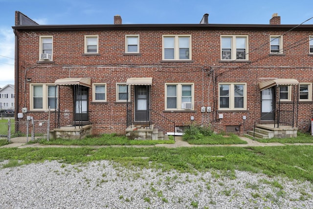 635-641 Racine Ave, Columbus, OH 43204 - view of front facade with brick siding, entry steps, a chimney, and cooling unit