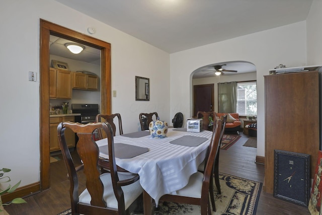 635-641 Racine Ave, Columbus, OH 43204 - dining space featuring arched walkways, dark wood-style flooring, and a ceiling fan
